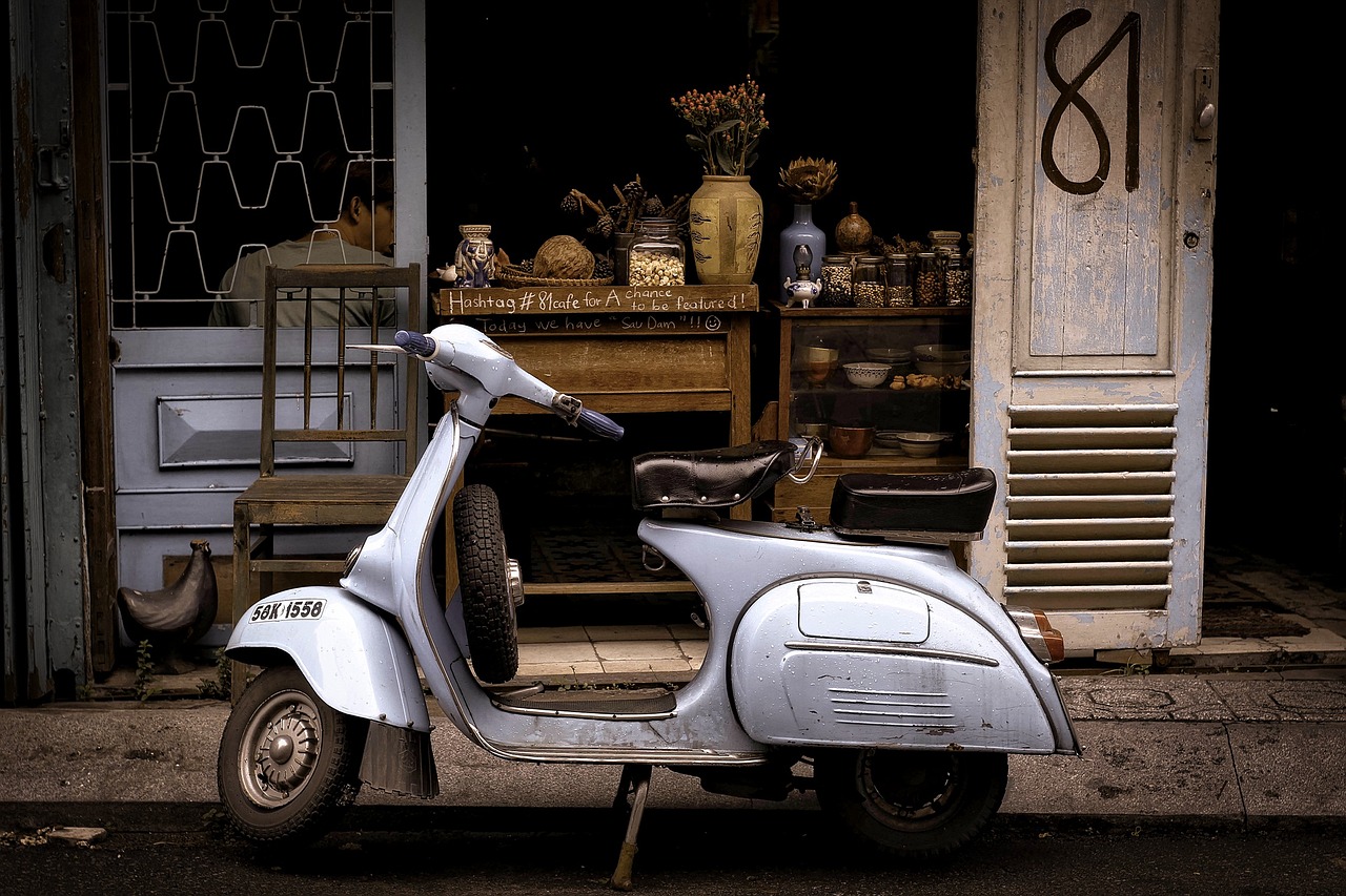 Scooter parked outside a shop